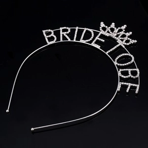 Close-up of silver rhinestone Bride To Be headband with mini crown for bachelorette parties