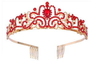 Detailed view of vintage gold tiara with red crystals and secure hair comb base