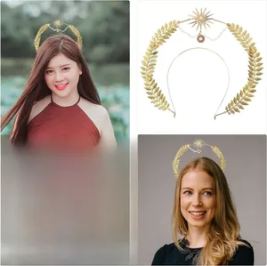 Detail of Boho gold laurel leaf headband with sunburst pendant and white pearl accents