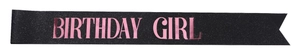 Detail of black glitter birthday girl sash with rose gold metallic foil lettering