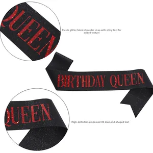 Detail of glitter fabric birthday sash featuring holographic Birthday Queen text