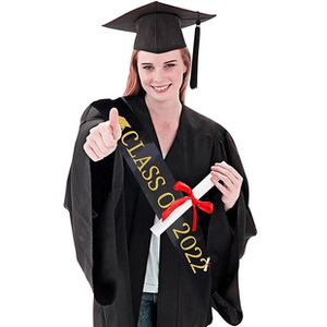 Close-up of Class of 2022 graduation sash in black satin with gold foil lettering