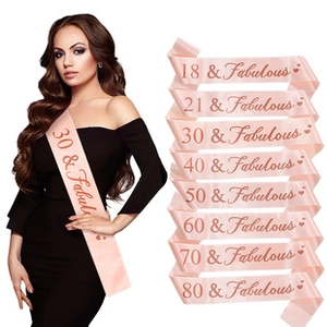 Detail of champagne pink satin Mom To Be sash with rose gold lettering for party