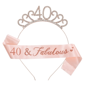 Detail of rose gold 40th birthday tiara with rhinestones and 40 & Fabulous pink satin sash