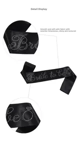 Detail view of black satin sash with sparkling rhinestone Bride To Be lettering and icons