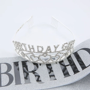 Close-up of glittery silver Birthday Girl sash and sparkling rhinestone tiara set