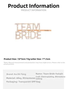 Detailed close-up of golden Team Bride rhinestone bobby pin with size measurements