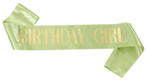 Detail of light green satin Birthday Girl sash with gold metallic text for party