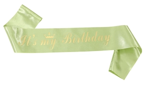 Detail of light green satin birthday sash with gold crown and It's my Birthday text