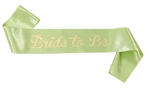 Detail of light green satin Bride to Be sash with gold lettering and crown graphics