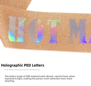 Detail of glitter fabric party sash with holographic 'HOT M' lettering for Mother's Day