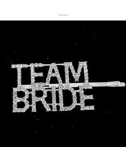 Macro view of silver Team Bride hair clip with sparkling rhinestones for weddings