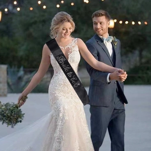 Elegant black Bride to Be sash with white glitter lettering for bachelorette party
