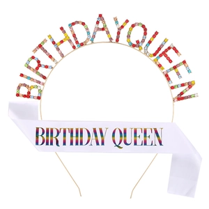 Detail of BIRTHDAY QUEEN gold rhinestone headband and white satin sash with rainbow text