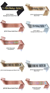 Close-up of Birthday Bitch glitter sashes with bold and cursive typography in various colors