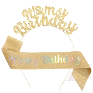 Detail of glittery gold 'It's my Birthday' headband and sash set for party decorations