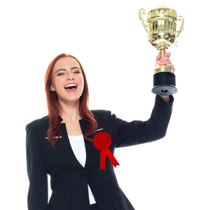 Classic gold award trophy with handles and black base held by a smiling woman in a suit