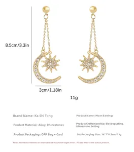 Detail view of gold celestial earrings with rhinestones showing dimensions of 8.5cm by 3cm