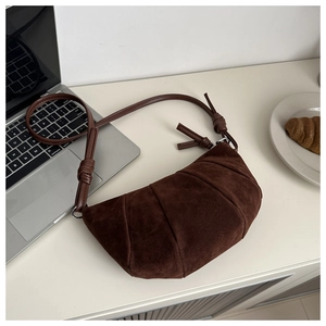 Deep brown suede croissant bag with draped pleats and knotted strap detail