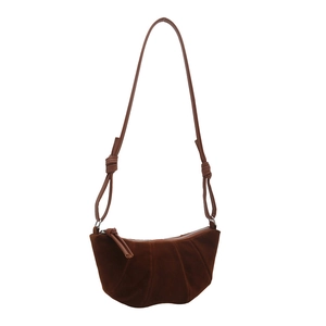 Dark brown suede croissant bag with pleated design and knot detail shoulder strap