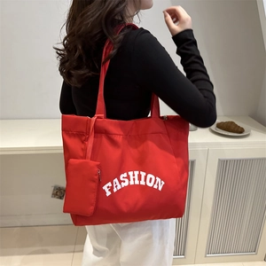 Red nylon tote bag with Fashion print and matching small pouch for casual shopping