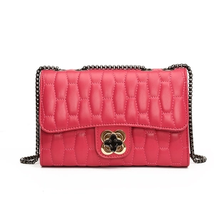 Chic quilted crossbody bag in rose red with gold clover lock and chain strap