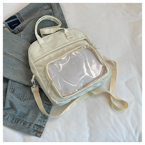 Détail du sac ita blanc crème avec fenêtre PVC transparente et tissu en nylon durable