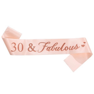 Detail of pink satin 30 & Fabulous birthday sash with glitter rose gold lettering