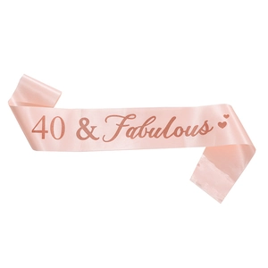 Detail of rose gold 40 & Fabulous glitter text on pink satin birthday sash