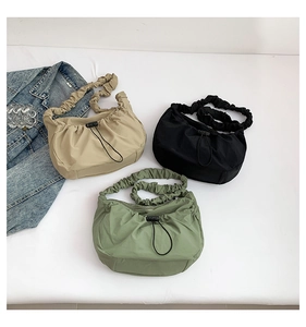 Nylon drawstring bags in khaki, black and green with signature ruched shoulder straps