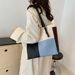 Minimalist large patchwork tote bag in leather with adjustable black straps for women