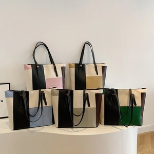 Chic color-block tote bags in various colorways with spacious interior and sleek handles