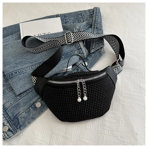 Detail of black rhinestone chest bag with herringbone strap and pearl zipper pulls