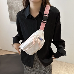 Chic white quilted chest bag for women with stylish pink adjustable strap and fashion label