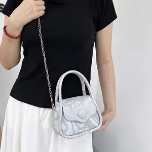 Fashionable marble print crossbody bag with gold chain strap for casual styling