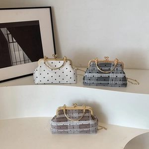 Three retro lace checkered shell bags with gold chain straps in black and white styles