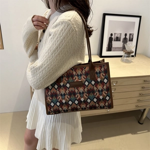 Chic 2024 woven tote bag with geometric diamond patterns and leather shoulder strap