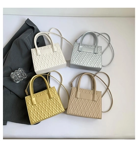 Quilted diamond texture detail on assorted chic minimalist crossbody bags in four soft tones
