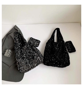 Detail of glittery sequins on tote bags and matching pouches for a sparkling texture
