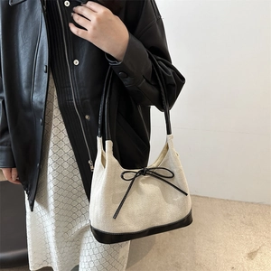 Large capacity canvas tote bag with bow detail and black leather trim for women