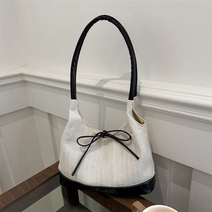 Large capacity canvas tote bag with bow detail and herringbone pattern in cream and black