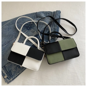 Detailed close-up of textured leather stitching on retro color-block mini square bags
