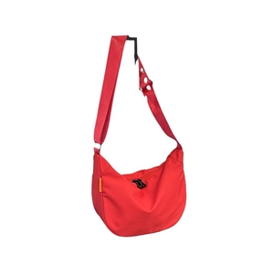 Red nylon crescent dumpling tote bag with a wide strap and black zipper for women