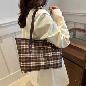 Classic brown plaid tote bag with long leather handles and vintage check pattern for women
