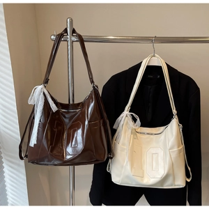 Detail view of American vintage tote bags with number embroidery and lace ribbon bows