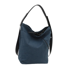 Blue denim shoulder bucket bag with black ribbon drawstring and wide leather strap