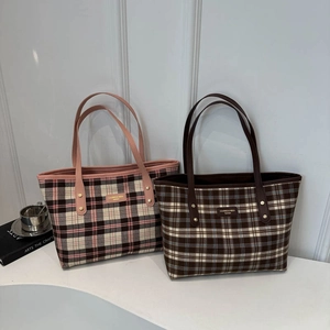 Vintage plaid tote bags in pink and dark brown colors featuring elegant metal hardware