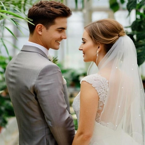 Elegant double-layered white bridal veil with rhinestones and lace embroidery