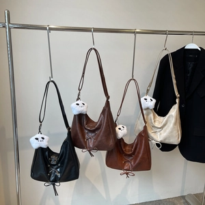 Chic half-moon crescent crossbody bags in black, brown, and beige with star charms