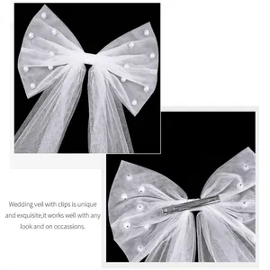 Elegant white tulle bow hair clip with faux pearls for bridal wedding headpiece